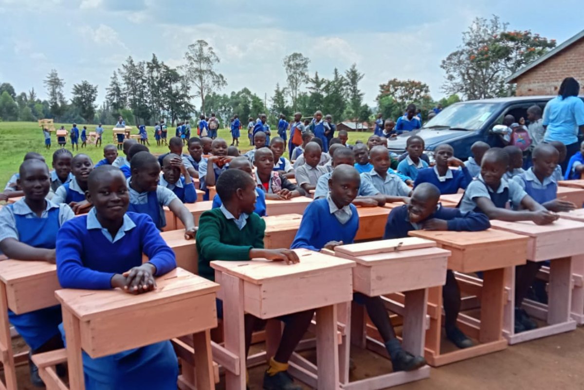 Students receiving desks through the Friends of Dago Desk Project